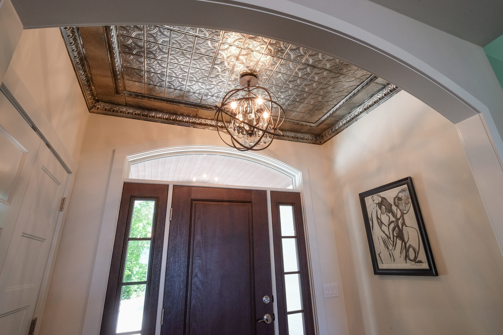 Tin Ceiling in the Entryway adds a lot of character! Pennings & Sons